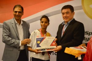 Chairman Kartikay Saini presenting certificates to coaches during Special Olympics Conference